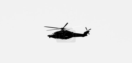 Photo for Military helicopter flying over the sky of the Spanish coast - Royalty Free Image