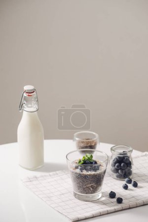 Photo for "Chia pudding with fresh berries and almond milk. Superfood concept. Vegan, vegetarian and healthy eating diet with organic products" - Royalty Free Image