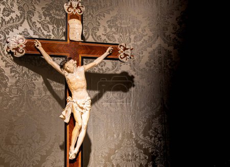Photo for Old crucifix made of wood and ivory. Jesus Christ symbol of resurrection and life after the death. - Royalty Free Image