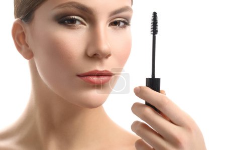 Photo for Young woman holding mascara - Royalty Free Image