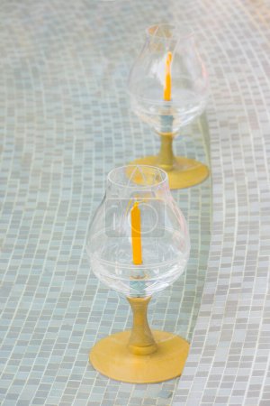 Photo for "Glass holders for candles in Buddhism" - Royalty Free Image