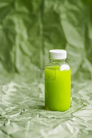 Photo for "Fresh green juice in eco-friendly recyclable plastic bottle and packaging, healthy drink and food product" - Royalty Free Image