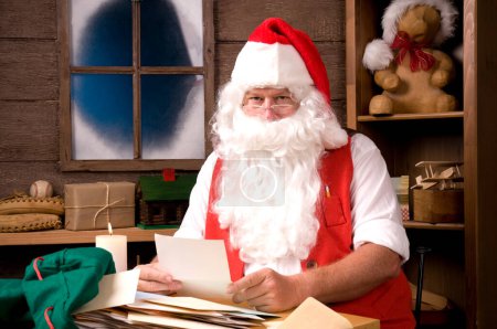 Photo for Santa Claus in Workshop With Bag of Letters - Royalty Free Image
