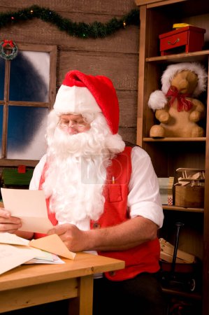 Photo for "Santa Claus in Workshop With Letters" - Royalty Free Image