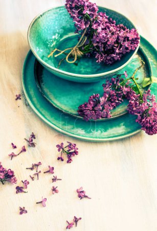 Photo for Spring lilac flowers on table - Royalty Free Image