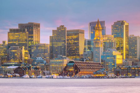 Photo for "Panorama view of Boston skyline with skyscrapers over water at twilight inUSA" - Royalty Free Image