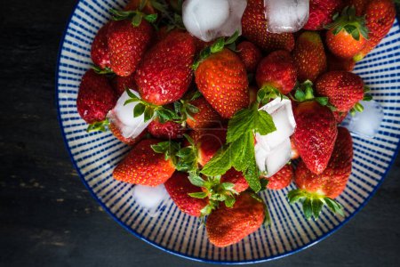 Photo for Close-up shot of fresh organic strawberries on tabletop for background - Royalty Free Image