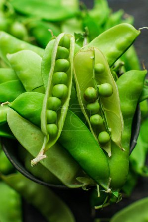 Photo for Close-up shot of fresh organic green peas on tabletop for background - Royalty Free Image