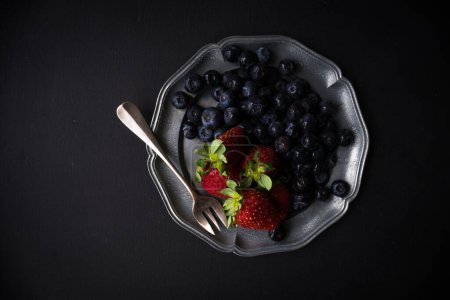 Photo for Close-up shot of fresh organic berries on tabletop for background - Royalty Free Image