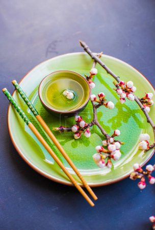Photo for "Green tea and peach blossom as a spring concept" - Royalty Free Image