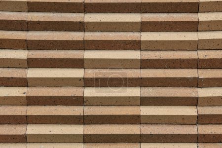 Photo for The background image of triangles comes from brickwork covered over large cement columns - Royalty Free Image