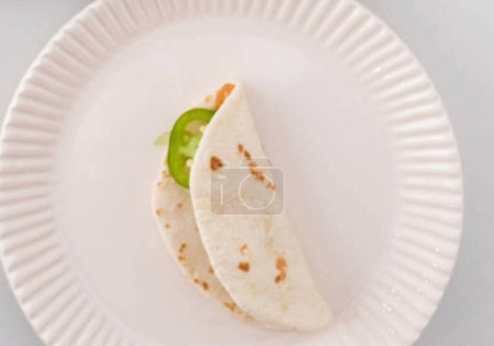 Photo for Close-up shot of delicious taco with green pepper for background - Royalty Free Image