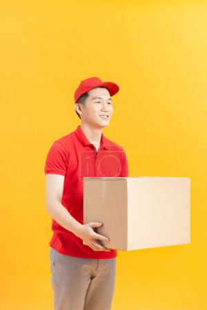 Photo for Delivery man with box on color background - Royalty Free Image