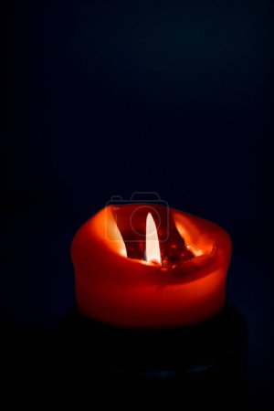 Photo for Red holiday candle on dark background, luxury branding design and decoration for Christmas, New Years Eve and Valentines Day - Royalty Free Image
