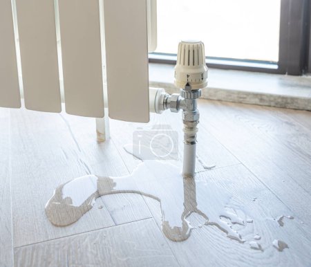 Photo for "water leak through the heating radiator" - Royalty Free Image