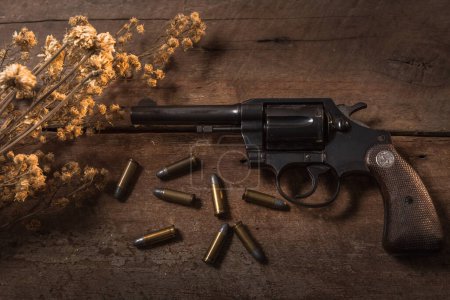 Photo for Handgun bullets on wood table - Royalty Free Image