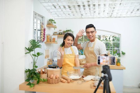 Photo for "Couple making dough together, baking and cooking concept rustic style photo for cook book and cook blog" - Royalty Free Image