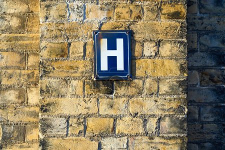 Photo for The letter H on a sign on a wall - Royalty Free Image
