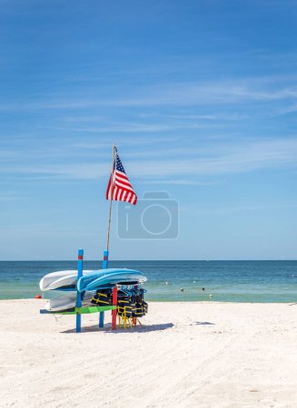 Photo for ST.PETE BEACH, FLORIDA, USA - SEPTEMBER 03, 2014: Life jackets and boats on St.Pete beach in Florida, on September, 2014, USA. - Royalty Free Image