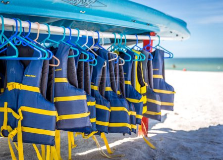 Photo for ST.PETE BEACH, FLORIDA, USA - SEPTEMBER 03, 2014: Life jackets and boats on St.Pete beach in Florida, on September, 2014, USA. - Royalty Free Image