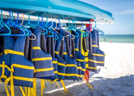 Photo for "Life jackets and boats on St.Pete beach in Florida, USA." - Royalty Free Image
