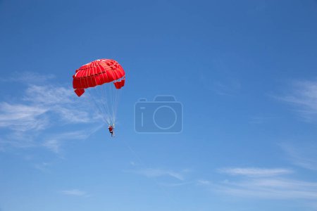 Photo for Man Parachuting on a sunny day - Royalty Free Image