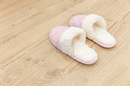 Photo for Pink cozy knitted slippers - Royalty Free Image