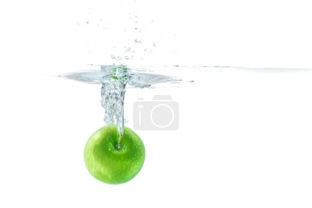 Photo for Water splash. Green apple under water. Air bubble and transparent water. - Royalty Free Image