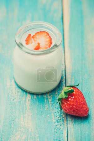 Photo for "Strawberry Yoghurt. Healthy food with Strawberries and yoghurt breakfast on table." - Royalty Free Image