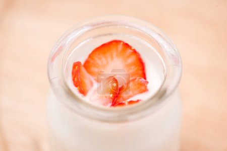 Photo for "Strawberry Yoghurt. Healthy food with Strawberries and yoghurt breakfast on table." - Royalty Free Image