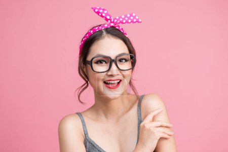 Photo for Fashion portrait of asian girl with sunglasses standing on pink background. - Royalty Free Image