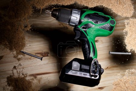 Photo for "Conceptual photo of green power drill" - Royalty Free Image