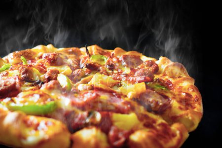 Photo for "Pizza with cheese ham bacon and pepperoni on isolated black background with hot steaming smoke. Food and cooking concept. Lunch time serve and hungry theme. Pizza delivery service to home advertising" - Royalty Free Image
