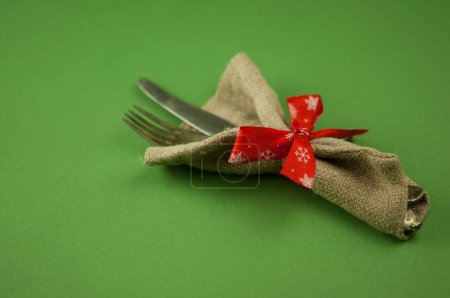 Photo for Vintage silverware decorated with red ribbon - Royalty Free Image