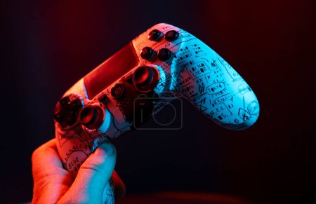 Photo for "Joypad in hand 4" - Royalty Free Image