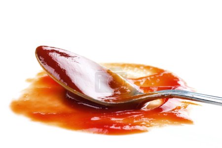 Téléchargez les photos : Ketchup et cuillère sur fond, gros plan - en image libre de droit