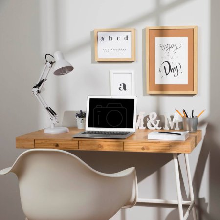 Photo for Nice organised workspace with lamp - Royalty Free Image
