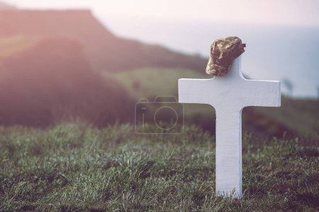 Photo for "military cap on the grave cross" - Royalty Free Image