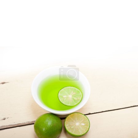 Photo for Green lime lemonade  on background, close up - Royalty Free Image