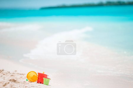 Photo for Beach kid's toys on white sand beach - Royalty Free Image
