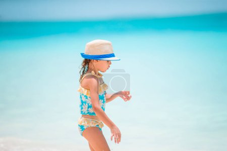 Photo for Cute little girl at beach during vacation - Royalty Free Image