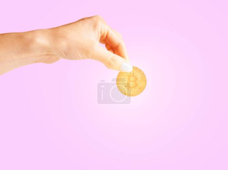 Photo for Womans hand holding glowing bitcoin - Royalty Free Image