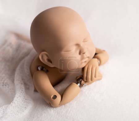 Photo for Plastic figure of newborn for photographing - Royalty Free Image