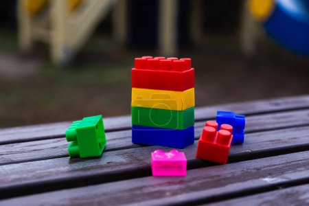 Téléchargez les photos : Colorful toy building blocks or bricks On wood background - en image libre de droit