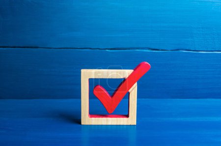 "Red voting check mark on a blue background. Voting concept for democratic elections. Make the best choice, solve the problem. Social poll. Rights and freedoms. Lawmaking. Approval symbol"