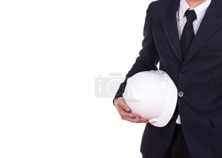 Téléchargez les photos : Ingénieur en costume portant casque - en image libre de droit