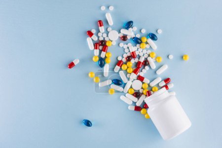Photo for Colorful pills plastic bottle - Royalty Free Image