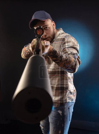 Photo for The guy in the shirt with the rifle - Royalty Free Image
