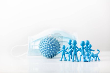 Photo for "Group of plastic figures, abstract model of coronavirus and Medical mask on light gray background" - Royalty Free Image