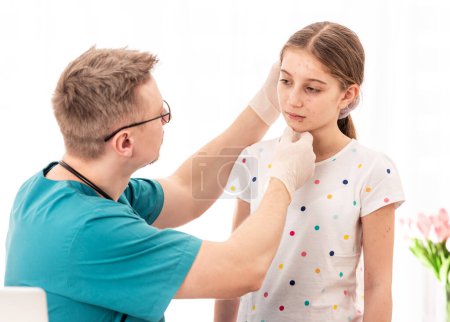 Photo for Medic checking girls appearance on white background - Royalty Free Image